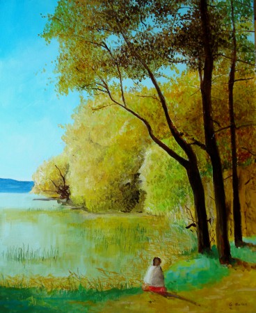 femme assise au bord d'un étang enautomne